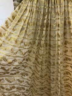 "Vintage 1970s Harvey Berin beige/gold beaded rhinestone semi sheer paisley brocade gown with zip closure up the back and zip up sleeves at wrist MEASUREMENTS: Chest: 36\" Waist: 29\" Length: 59\" Sleeve: 28.5\" All measurements taken with garment laid flat. Modern Size Estimate: S/M CONDITION: Excellent Vintage Condition- general wear with age, some missing beads/rhinestones and fraying All items at Time Warp are vintage, so there is some wear. They may not be 100% free of minor defects, as the Cream Floor-length Party Dupatta, Bollywood Style Gold Evening Dress, Gold Bollywood Evening Dress, Fitted Gold Dress With Chikankari Embroidery, Gold Maxi Length Dress With Dupatta, Gold Dress With Chikankari Embroidery And Traditional Drape, Gold Brocade Dress With Dupatta, Festive Gold Dress With Chikankari Embroidery, Gold Dress With Chikankari Embroidery In Traditional Drape