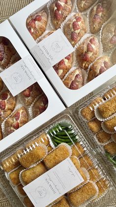 three boxes filled with pastries sitting on top of a table