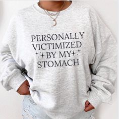 PLEASE READ ENTIRE DESCRIPTION BEFORE ORDERING Unisex Fit Personally Victomized by stomach sweatshirt, Stomach Problems, Tummy Hurts, Ibs, Crohns, Celiac shirt, Tummy ache survivor Fall in love with this soft and cozy Graphic Tee, Sweatshirt or hoodie  TO MAKE YOUR SHOPPING EXPERIENCE EASIER, YOU CAN "CHOOSE" A SWEATSHIRT OR HOODIE IN THIS LISTING. Size up 1-2 sizes for a slouchy oversized fit DTG PRINTING Sweatshirt and Hoodies Sizes: S M L XL 2X 3X 4X 5X Handmade  Unisex Fit Crewneck Sweatshirts 50/50 cotton polyester  Long Sleeve Not Available in Youth TEES (Separate listing) 100% Cotton Sizes:  Youth Tee: XS-XL Unisex Tees: S-5X *TRUE TO SIZE.  Size up if you want it oversized. Great for: Matching Group Shirts Matching Family Funny sweaters Gifts for her Gifts under $50 Christmas gift Tummy Ache Survivor, Tummy Hurts, Tummy Ache, Funny T Shirt Sayings, Stomach Problems, Funny Sweaters, Effortless Outfit, Cute Shirt Designs, Group Shirts