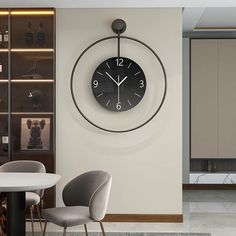 a clock mounted to the side of a wall above a dining room table and chairs