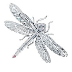 This exquisite  Dragonfly Brooch captures the delicate beauty of a dragonfly, adorned with a dazzling array of ruby pink and white zirconia. The body of the dragonfly features alternating stripes of pink and white, along with pink eyes, creating a stunning visual contrast that is sure to catch the eye. The wings are intricately designed with a lace-like pattern, encrusted with sparkling white zirconia that shimmer with every movement, and the tail of the dragonfly is elegantly finished with a la Hamsa Hand Jewelry, Pink Tourmaline Jewelry, Pink Dragonfly, Dragonfly Brooch, February Birthday Gifts, Mother Of Pearl Jewelry, Brown Jewelry, August Birthstone Jewelry, July Birthstone Jewelry