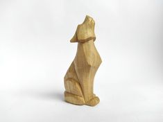 a wooden dog sitting on its hind legs