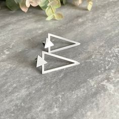 These Triangle earrings offer a simple and modern look. Exquisitely crafted from stainless steel, these ear jackets make a bold statement. Can be used as a simple small triangle, without the back part. Sold as pair Material :316 Stainless steel Gauge: 24G regular piercing Small triangle stud : 7mm Triangle back : 27mm long Closure: Push pack Listing for pair of triangle earrings only Black Triangle Earring, Unisex Earrings, Ear Jacket Earring, Gothic Earrings, Triangle Studs, Ear Jacket, Triangle Earrings, Black Earrings, Geometric Earrings