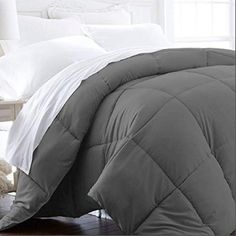 the comforter is made up and ready for someone to use it in their bed