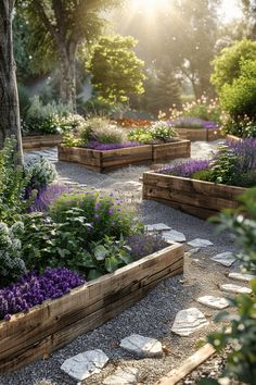 a garden filled with lots of different types of flowers and plants in wooden boxes next to a tree