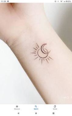 a small sun and moon tattoo on the wrist