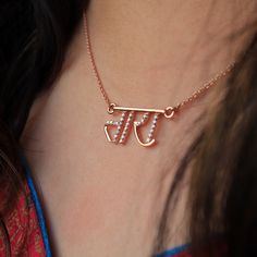 "Hand lettered Hindi straight font name necklace pendant, crafted in 14k solid gold and genuine natural diamonds, this personalized necklace makes a unique customized gift for one and all. * Diamond Wt. : 0.21-0.25 Ct. (approx.) * Diamond Color-Clarity Grade : H I - Vs Si * Gold - 2 g, 14k gold (approx.) * Pendant Width : 1 inch * Pendant Height : Will vary depending on the name length * Chain Length - 14-18\" cable chain P.S. The design will be finalized with you through sketches before startin Personalized Tan Jewelry For Anniversary, Diamond Initials Name Necklace For Gift, Diamond Initials Name Necklace As Gift, Rose Gold Initials Pendant Necklace, Diamond Name Pendant Necklace, Personalized Diamond Necklace For Anniversary, Customized Diamond Necklaces For Personalized Gifts, Customized Diamond Necklace For Personalized Gift, Diamond Ear Cuff