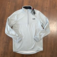 Brand New Under Armor, Light Gray With Three-Quarter, Zip Front, Black Logo, And Inside Color, Dress Up Or Dress Down, Cold Gear, Excellent Condition Under Armour Quarter Zip, Under Armour Long Sleeve Fleece Sweatshirt, Under Armour Hooded Winter Sweatshirt, Under Armour Moisture-wicking Sports Top, Under Armour Moisture-wicking Crew Neck T-shirt, Under Armour Shirts, Color Dress, Under Armor, Black Logo