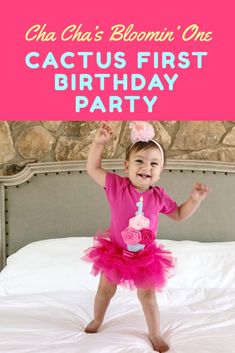 a baby girl holding up a sign that says, chu chu's blooming one cactus first birthday party