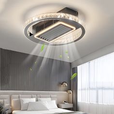 a bed room with a neatly made bed and a ceiling light