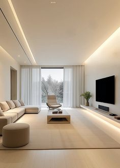 a modern living room with white walls and flooring is lit by recessed lighting