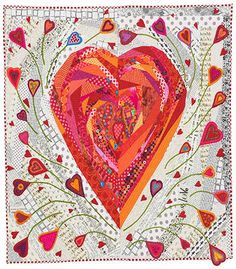 a quilted heart on a white background with red and pink hearts in the center