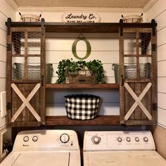 a washer and dryer in a laundry room with an open shelving unit