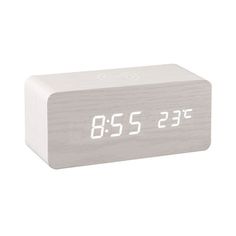 an alarm clock with the time on it's display is shown against a white background