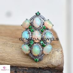 Wonderful Opal Gemstone Ring, Pave Diamond Jewelry, Gemstone Ring Jewelry, 925 Sterling Silver Ring, Oxidized Ring Jewelry, Birthstone Ring Gross Weight: 9.66 gram, Gemstone Weight: 6.30 cts Diamond Weight: 0.60 cts Ring Size: 35X22 MM NOTE:- All The Products Are Designed And Manufactured In My Workshop By Me & My Team. Shown Products Are Purely Handmade. Custom Orders Are Open Handly Accepted. We Are the Perfect Choice For Any Custom Jewelry Manufacturing. For Bulk Orders Please Message me. Multi-stone Sterling Silver Opal Ring, Silver Opal Ring With Stones, Sterling Silver Multi-stone Opal Ring, Sterling Silver Round Opal Ring, Sterling Silver Opal Ring With Multi-stone Design, Anniversary Opal Ring With Gemstone Accents In Sterling Silver, Anniversary Sterling Silver Opal Ring With Gemstone Accents, Oval Multi-stone Opal Ring In Sterling Silver, Oval Silver Opal Ring With Detailed Stones