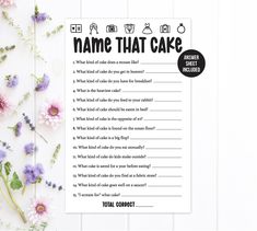 a baby shower game with flowers next to it on a white table and the words, baby shower feud written in black