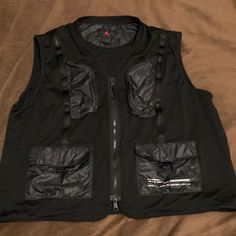 Jordan Mesh Vest Men’s Xxl Vest With Four Front Pockets Color Is Black With White Print Mesh Venting With Lightweight Polyester Pockets Dual Metal Zippers In Front Excellent Used Condition / Like New Across The Bottom Of The Armpits Is 27” Too Behind Neck To Bottom Is Also 27” Jordan Jackets, Mesh Vest, Vest Men, Jordans For Men, Mens Vest, Mens Jackets, Jordan, Jackets & Coats, Like New