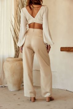 Your spring fit just got that much better thanks to the Jaxon Cream Trousers. Wear from work to happy hour, these pants are easily dressed up or down. Style with your favorite crop, our Isla Straw Fedora, a pair of strappy sandals, and you're set for the entire day! PRODUCT DESCRIPTION AND MATERIALS: - cream wide leg trousers - pleated - button closure - functional front pockets - non-functional welt back pockets - high waisted fit - finished hem - 100% lyocell - dry clean only SIZE RECOMMENDATI Casual Beige Dress Pants For Spring, Non-stretch Spring Dress Pants, Straight Leg Dress Pants For Business Casual In Spring, Chic Non-stretch Wide Leg Pants With Belt Loops, Spring Date Night Bottoms With Belt Loops, Versatile Wide Leg Spring Dress Pants, Fitted Pants For Business Casual In Spring, Versatile Wide-leg Spring Dress Pants, Wide Leg Pants For Date Night In Spring