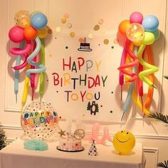 a birthday party with balloons and decorations