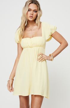 Gauzy cotton keeps you cool in a playful babydoll dress that ties at the back and features puff short sleeves. Ties at back Square neck Short sleeves Lined 100% cotton Hand wash, line dry Imported Yellow Dress With Cowboy Boots, Country Dance Outfit, Gracie Concert, Cute Yellow Dress, Concert Ideas, Loose Mini Dress, Concert Fit, Yellow Fits, Brunch Dress