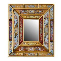 a decorative mirror with an intricate design on it