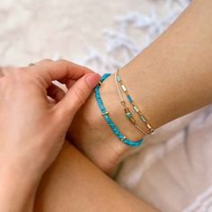 A subtle statement for spring. The Turquoise Chip Bitty Braid Anklet lives up to it's name as a petite plus up to your bracelet stack with a mix of turquoise between gold spacers on a natural, beige bitty braid. - Turquoise chip beads, unique in size, roughly 5mm in height - Gold plated brass spacer beads on either side of turquoise - Wax-coated- Adjustable from approximately 3-6 inches in diameter- Because jewelry products are handcrafted by artisans, dimensions may vary from piece to piece Anklet Stack, Cord Bracelet Diy, Costa Rica Pura Vida, Freestyle Watch, Bracelets Easy, Cloud Stickers, Sup Accessories, Rainbow Sandals, Pura Vida Bracelets