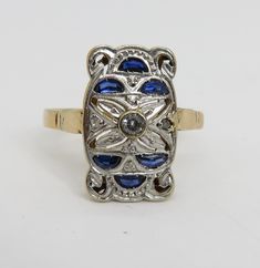 Estate wonderful art deco 18k yellow gold with platinum top sapphire diamond ring. sz 8.25. 3 grams. 16.49mm long. unmarked acid tests for 18k.great condition. estate 1920's ring. will come in great ring box. beautiufl estate piece. 3 small diamond and 6 sapphires. Art Deco Yellow Gold Ring With Diamond Accents, Yellow Gold Multi-stone Art Deco Jewelry, Art Deco Multi-stone Yellow Gold Jewelry, Art Deco Yellow Gold Multi-stone Jewelry, Antique Multi-stone Gold Diamond Ring, Art Deco Yellow Gold Diamond-cut Ring, Collectible Yellow Gold Rings With Diamond Accents, Art Deco Yellow Gold Diamond Cut Ring, Antique Gold Multi-stone Ring