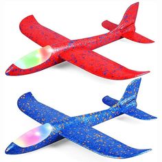 three different types of toy airplanes on a white background, one is red and the other is blue