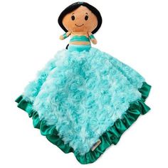 a stuffed doll in a blue and green blanket