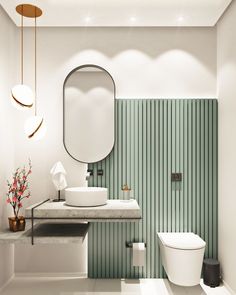 a white toilet sitting next to a bathroom sink under a round mirror on a wall