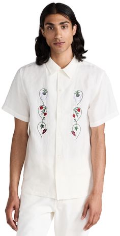 Find DE BONNE FACTURE Linen Embroidered Camp Collar Short Sleeve Shirt on Editorialist. Fabric: Lightweight, non-stretch linen weave. Floral and fruit embroidery at front. Camp collar and button placket. Short sleeves. Shell: 100% linen. Wash cold or dry clean. Made in Portugal. Measurements: Measurements from size M Length: 28in / 71cm Chest: 41in / 104cm Summer Embroidered Button-up Camp Shirt, Embroidered Button-up Camp Shirt For Summer, Summer Floral Embroidered Collared Camp Shirt, Spring Floral Embroidered Short Sleeve Camp Shirt, Embroidered Linen Tops With Relaxed Fit, Spring Vacation Embroidered Camp Shirt, Spring Vacation Embroidered Shirt, Spring Shirt With Floral Embroidery And Camp Collar, Spring Floral Embroidery Camp Collar Shirt