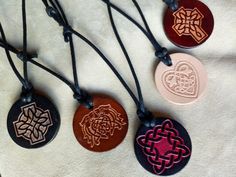 "Hand crafted leather necklace for women and men. Embossed Celtic leather talisman necklace in various styles and colors. Adjustable waxed cotton cord. The size of the pendant: 1 3/8\" (3.5cm) in diameter. Adult and child size. For more information please don't hesitate to contact me. For deliveries within the United Kingdom I use \"Royal Mail Standard 2nd Class\". Upgrade is available to \"Royal Mail Signed For\" if you prefer extra peace of mind. For deliveries to the rest of the world I use \ Leather Necklace With Adjustable Cord As Gift, Leather Necklace With Adjustable Cord For Gift, Traditional Leather Jewelry As Gift, Traditional Leather Jewelry For Gifts, Waxed Cord Pendant Necklace Gift, Waxed Cord Round Pendant Necklace For Gift, Triquetra Necklace, Braided Leather Necklace, Leather Patterns