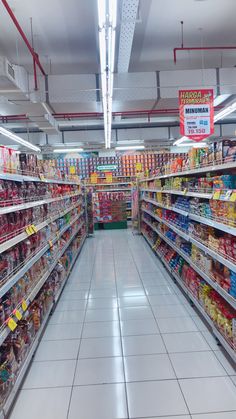 an aisle in a grocery store filled with lots of food