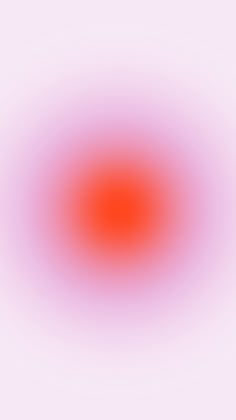 an orange and pink circle is shown in the middle of a white background with red center