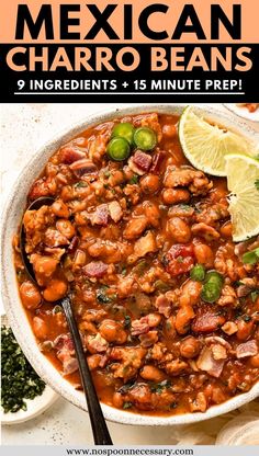 mexican charro beans in a white bowl with limes and cilantro on the side