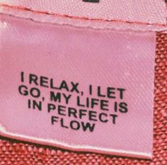 a pink label that says relax, i let go, my life is in perfect flow