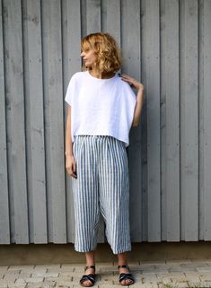 "Wide leg linen pants/culottes has a relaxed fit and are perfect for summer season. Made from locally manufactured pre-washed linen fabric. SILHOUETTE - pleated details at the front - zipper and button closure - side seam pockets - wide legs FABRIC&CARE Available in any other color of listed linen. We use medium weight and 100 % Oeko-Tex certified linen, which means that it meets ecological requirements. Hand wash or gently machine washable 30oC, hang dry recommended, iron on medium. *Linen Linen Culottes Outfit, Summer Linen Bottoms With Cropped Leg, Summer Cropped Linen Bottoms, Summer Linen Cropped Leg Pants, Summer Linen Cropped Pants, Summer Cropped Linen Pants, Striped Linen Pants Outfit, Summer Pants For Women, White Linen Cropped Pants