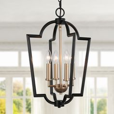 The 4-Light black and gold chandelier by Uolfin Lighting is a combination of black and gold and is one of the most popular elements in today's modern style. Minimal design meets soft industrial structure in the art deco chandelier. The intersecting pentagons make for a sleek physique to hang over your kitchen counter. In an open cage set up, the inner bulbs shine brightly through to paint your room with ample light. modern gold chandelier installs easily with a 59-in hanging chain allowing you t Dining Room Lantern, Kitchen Chandelier Lighting, Candle Modern, Modern Farmhouse Dining Room, Transitional Chandelier, Geometric Pendant Light, Cage Chandelier, Modern Farmhouse Dining, Kitchen Chandelier