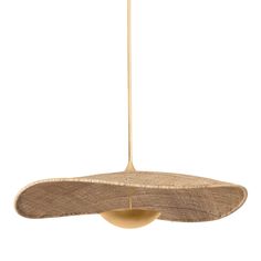 a light hanging from a ceiling fixture with a wooden base and woven material on it