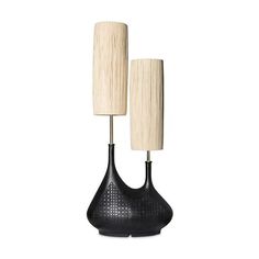 two black lamps sitting on top of each other