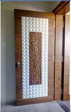 a wooden door with an intricate design on the front and side panels inlays