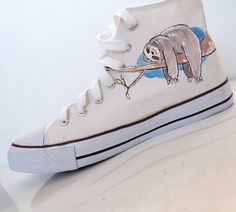 Custom hand painted Sloth Shoes.  Calm down! Slow down! Be like Sloth! Super cute design. Acrylic paint on canvas shoes. Every size is possible. I use US size chart!  Shoes are hand painted using High grade acrylic paint. I use a special textile paint designed to be flexible on fabric. The paint is water proof and fade proof. Let me know the style and your shoe size upon ordering as well as what you want painted on them, and feel free to send me any sketches or ideas you have. Follow me on Facebook: www.facebook.com/madcandies LET ME KNOW IF YOU NEED YOUR ORDER ASAP OR FOR A SPECIFIC DATE  SIZE Please remember: we've got US size range, check the table which you can see in every listing to be sure about size or let me know, if you've got any problem. Check INSOLE LENGTH! Doctor Who Shoes, Galaxy Shoes, Painted Canvas Shoes, Custom Painted Shoes, Painted Sneakers, Beaded Shoes, Rainbow Shoes, Acrylic Paint On Canvas, Shoes Cute