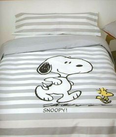 a bed with a snoopy cartoon on it