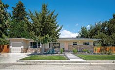 a house with trees in the front yard