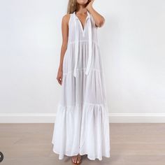 Honorine's Eve Tie-Neck Double Cotton Gauze Maxi Dress In White Is A Fabulous And Versatile Summer Dress. This Gorgeous Slightly Oversized, Floor Length Maxi Dress Has A Breezy, Tiered Shape, That Flows And Feels Almost As If You Are Wearing Nothing, Also, Featuring A Deep V Open Neck, Also A Self Tie Bow For A Little Modesty, If The V Is A Little Deeper Than You Like! Perfect Beach Dress, Vacation Dress, Throw On, Cover Up, Barefoot, With Flip-Flops, Sandals, And Or Wedges! - Keep In Mind It Is White Maxi-length V-neck Beach Dress, White Maxi V-neck Dress For Beach, White V-neck Sundress For Beach, White V-neck Sundress For Vacation, White Gauze Dress, Gauze Maxi Dress, Floor Length Maxi Dress, Dress Vacation, Vacation Dress