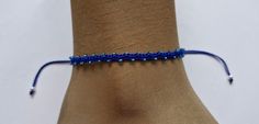 This elegant blue beaded anklet is handmade using dark blue cord woven with turquoise blue beads.   The ankle bracelet is adjustable, designed to slide over the foot and adjust to all ankle sizes. Handmade by myself at www.etsy.com/shop/katsmakes Blue Beaded Bracelets For Summer Festival, Adjustable Blue Anklets For Beach, Blue Bracelet Anklets For Beach, Adjustable Blue Anklets For Festival, Blue Beaded Bohemian Anklets, Adjustable Blue Bohemian Anklets, Bohemian Blue Anklets For Gift, Bohemian Blue Beaded Anklets, Blue Beaded Bracelets With Adjustable Cord