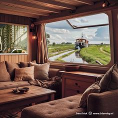 a living room filled with furniture next to a window