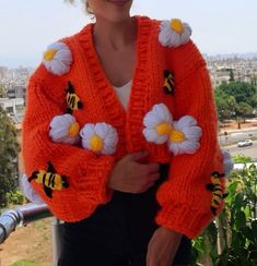 COLOR: orange (different colors can be knitted upon order.) PATTERN: daisy bee SIZE: xs. s. m. l (size xl. xxl can be knitted upon order.) LENGTH: (can be knitted to the desired length upon order.) AREA OF USE: daily use and can be given as a gift WASHING INSTRUCTIONS: short program at low temperature PACKAGING: safe packaging and gift wrap SHIPPING: safe cargo company and on-time delivery You can see my other cardigans on sale by visiting my store. Thank you for visiting my store. Title: "Warm Spring Orange Knit Outerwear, Orange Knit Outerwear For Spring, Cozy Orange Outerwear For Spring, Orange Knitted Spring Sweater, Orange Knitted Sweater For Spring, Spring Orange Knitted Sweater, Spring Orange Knitted Cardigan, Orange Knitted Long Sleeve Outerwear, Knitted Bee