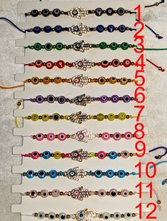 a bunch of bracelets that are sitting on a white board with the numbers 2012 - 2013