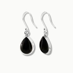 Bliss is an elegant pair of light-weight drop earrings perfect for everyday wear. Featuring high quality natural pear-cut black onyx gemstones, nestled elegantly in a fine sterling silver frame, our Bliss earrings will leave you radiating with inner joy all day long. Authentic Sivalya Black Onyx Black Onyx: Endurance, Perseverance, Grounding Hallmarked Metal: 925 Sterling Silver Gemstone Size: 15mm x 10mm Cut: Pear Cut Smooth Cabochons Classic Teardrop Earrings In Sterling Silver With Polished Finish, Classic Sterling Silver Teardrop Earrings With Polished Finish, Black Teardrop Earrings For Formal Occasions, Classic Black Drop Jewelry, Modern Black Drop Earrings, Elegant Teardrop Onyx Jewelry, Classic Black Teardrop Earrings, Elegant Black Teardrop Earrings In Sterling Silver, Classic Black Pear-shaped Jewelry